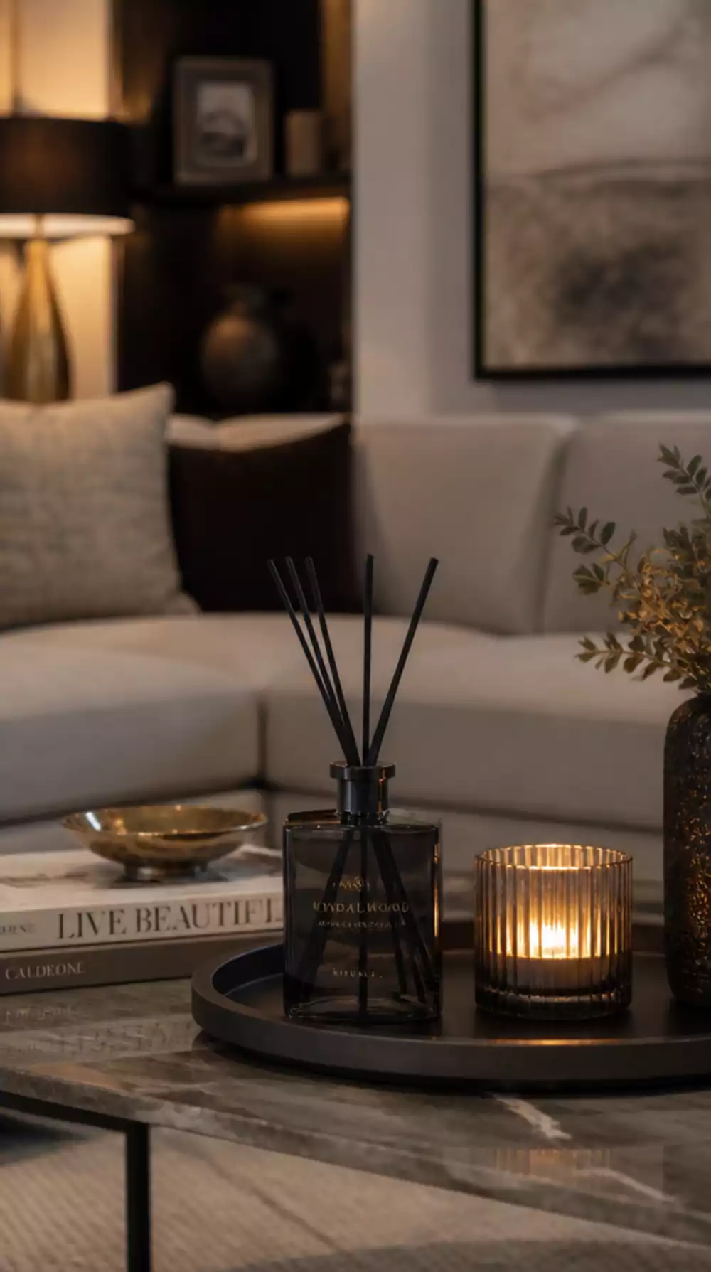 Living Room Reed Diffuser in a Slim Dark Glass Bottle Placed on a Coffee Table Tray Display