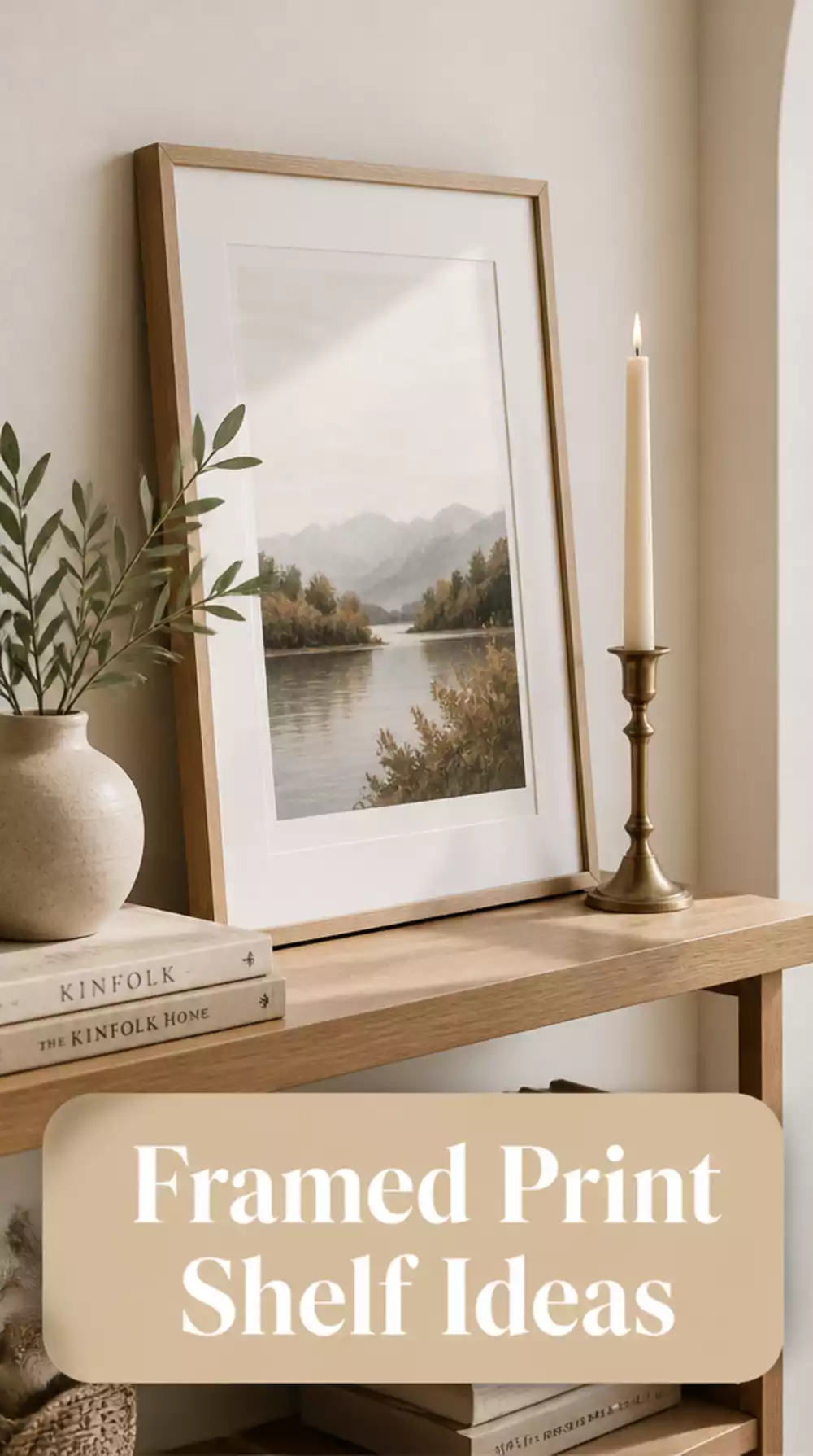 Living Room Shelf Styled With a Framed Print Leaning Against the Wall and a Single Candle