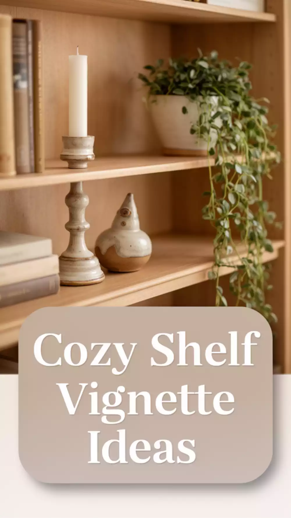 Living Room Bookshelf Vignette Using a Candle, Small Ceramic, and a Trailing Plant